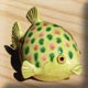 fat green ceramic fish