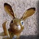 scratching ceramic hare sculpture